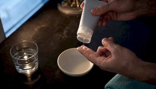 Hands preparing lubricant for safe use