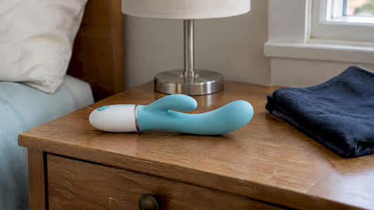 Dual-action heated vibrator on a bedside table
