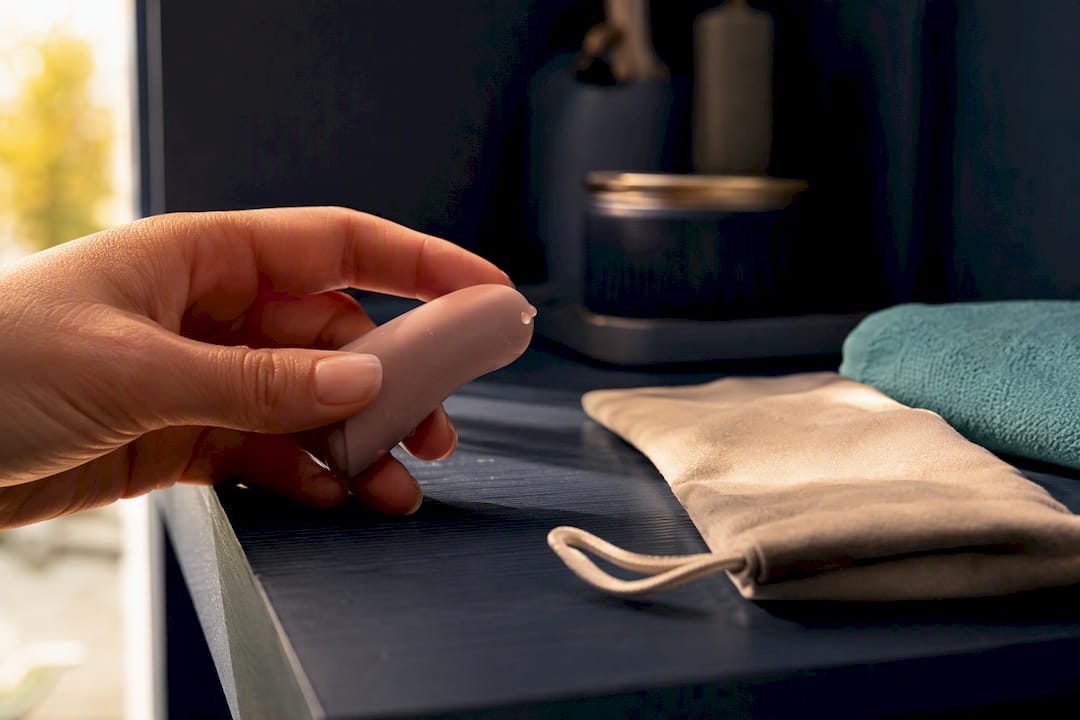 Hand inspecting anonymous silicone finger toy