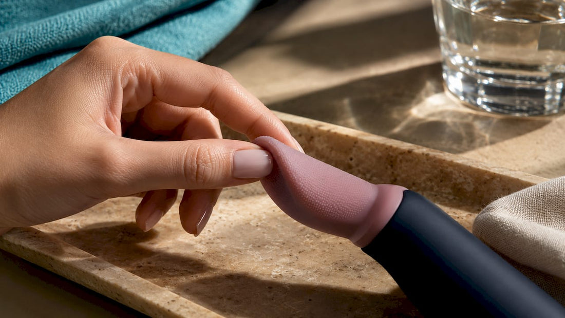 Hand examining an anonymous silicone tongue tip