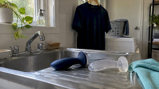 Adult toys being cleaned at utility sink